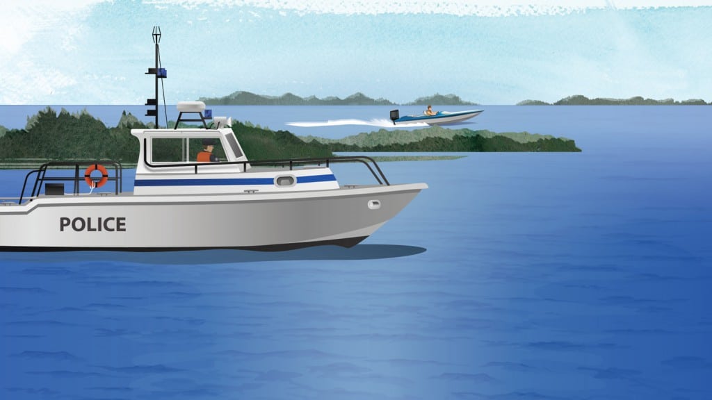 Law enforcement vessel on the waterway enforcing boat operator regulations
