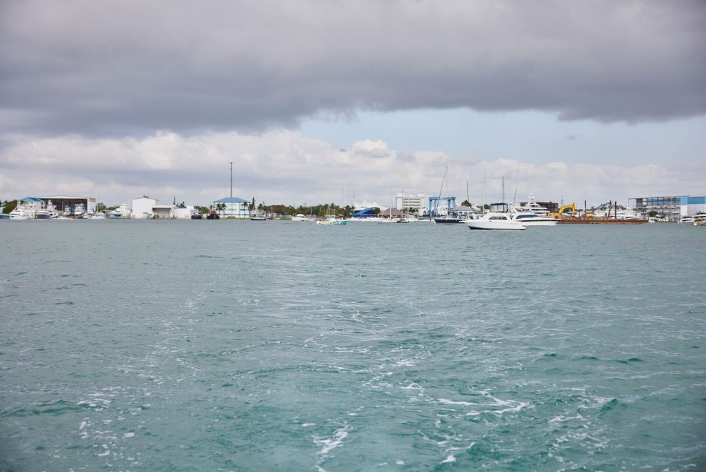 Clouds over the water near boats, check the weather before boating concept.