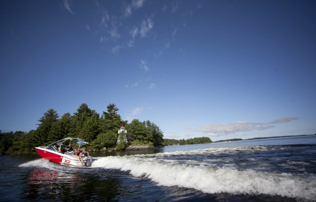 A boat moving on the water, Canadian boater concept.
