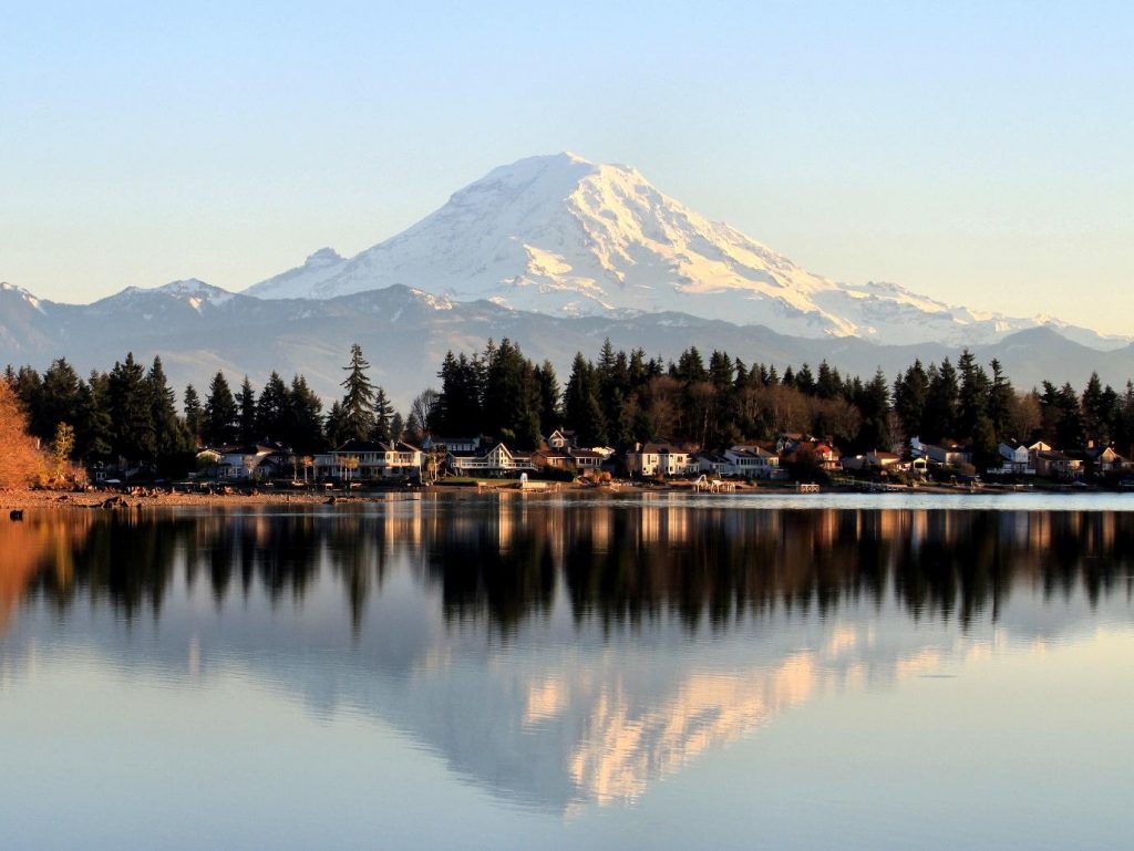 A view of Washington's Lake Tapps with the mountains behind it. 