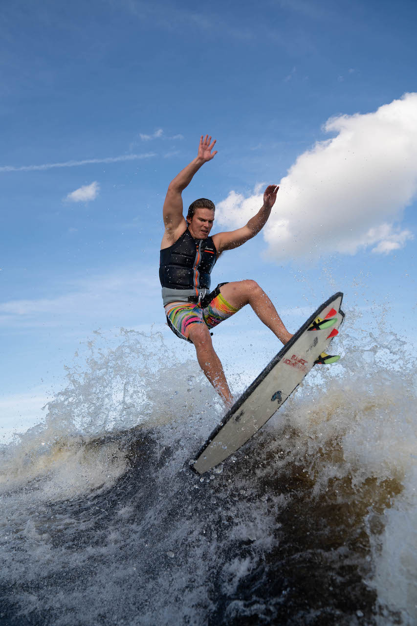 Keenan Flegal riding a wake while wake surfing.