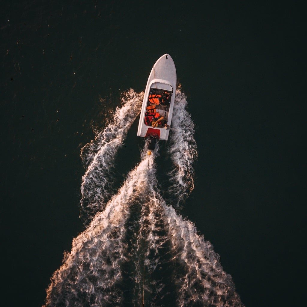 Overhead look at a boat moving on the water.