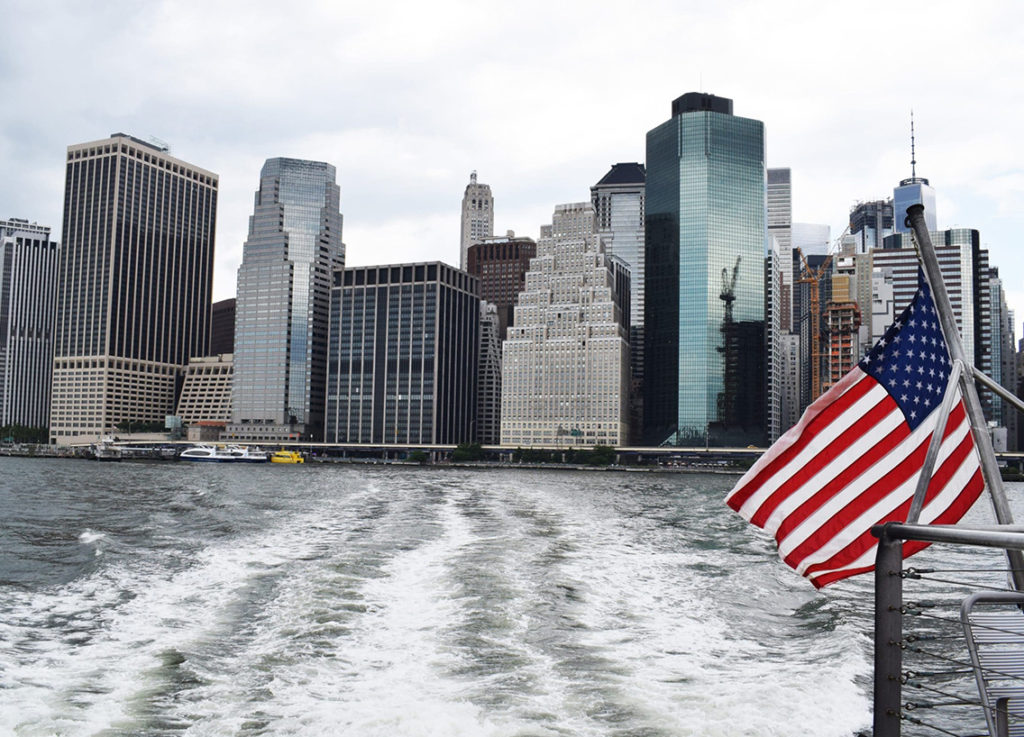 The view of New York skylines from the back of a boat, boating in New York concept.