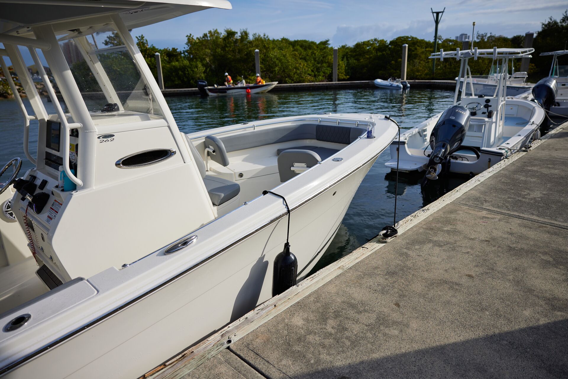 Boats moored at a dock at a marina. 