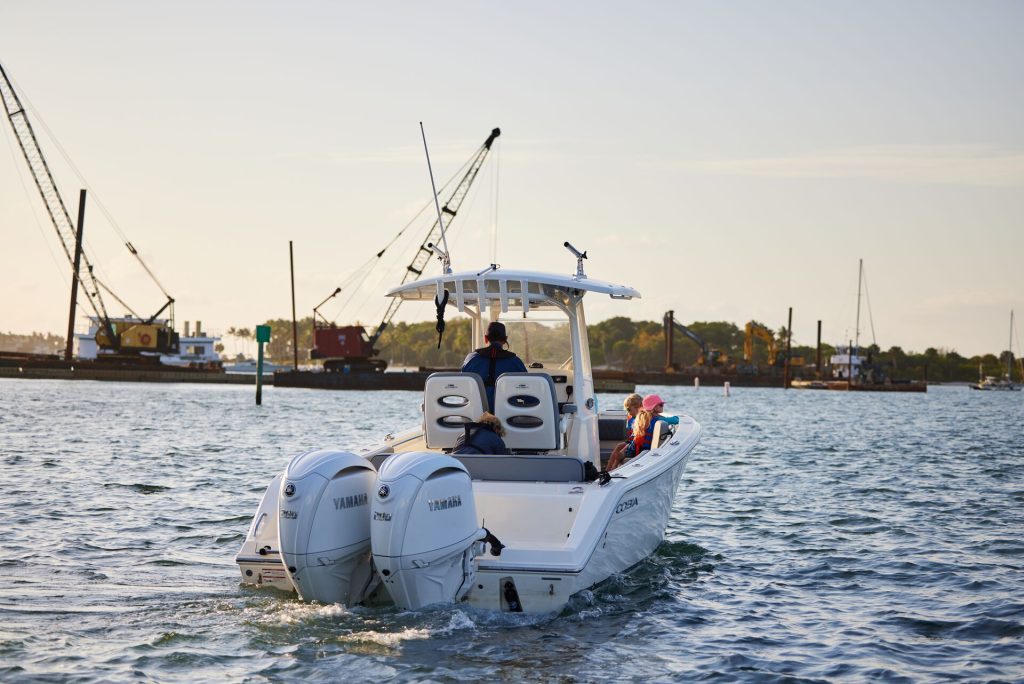 A person driving a boat, Washington boat registration concept.