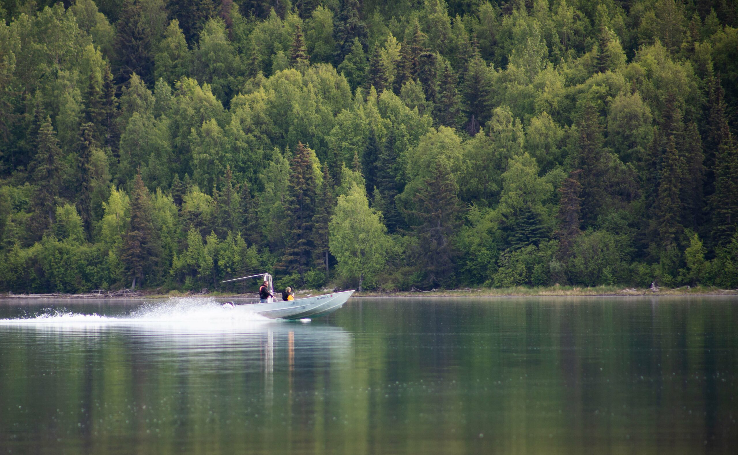 A boat moving across a lake, boating in Virginia concept.