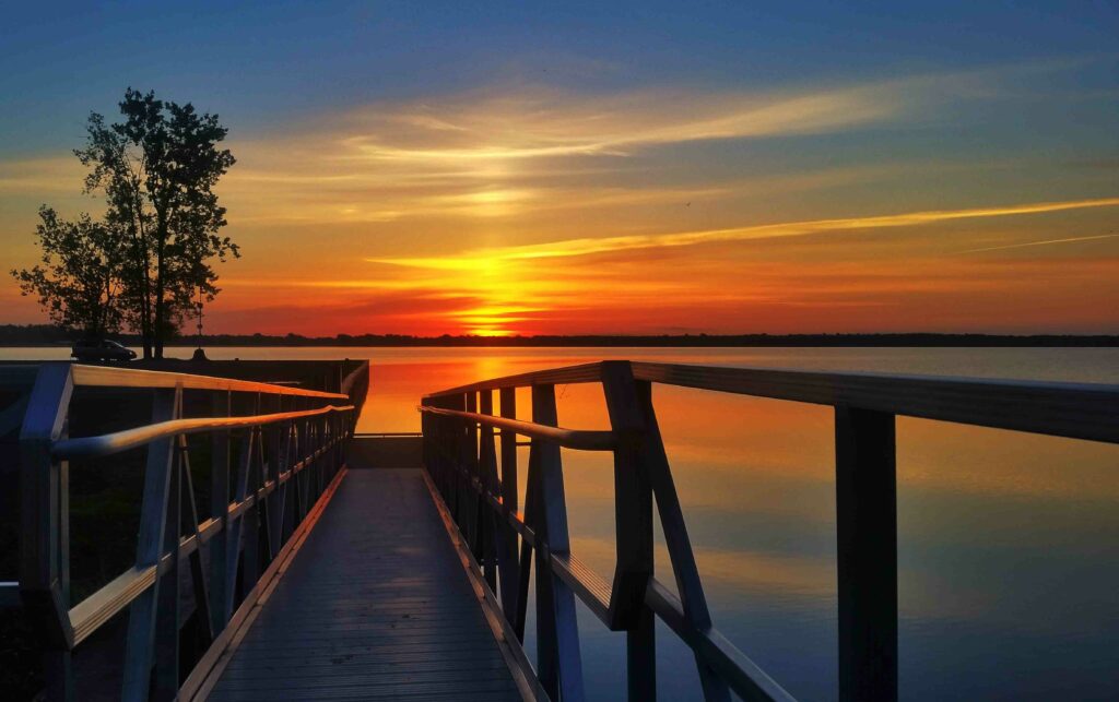 A boat dock at sunset, drive a boat in New York concept.
