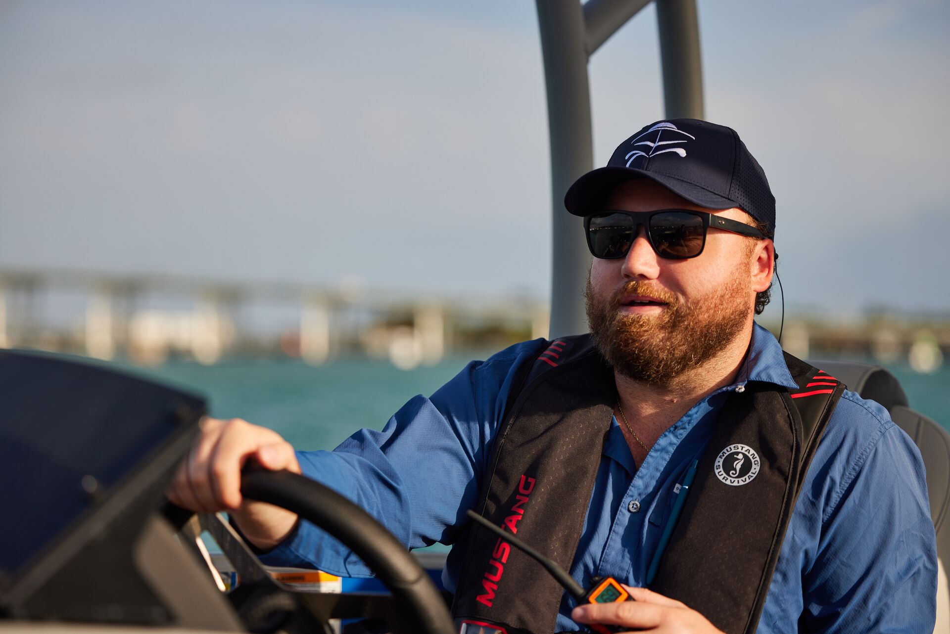 A man driving a boat, represents nautical adventures.