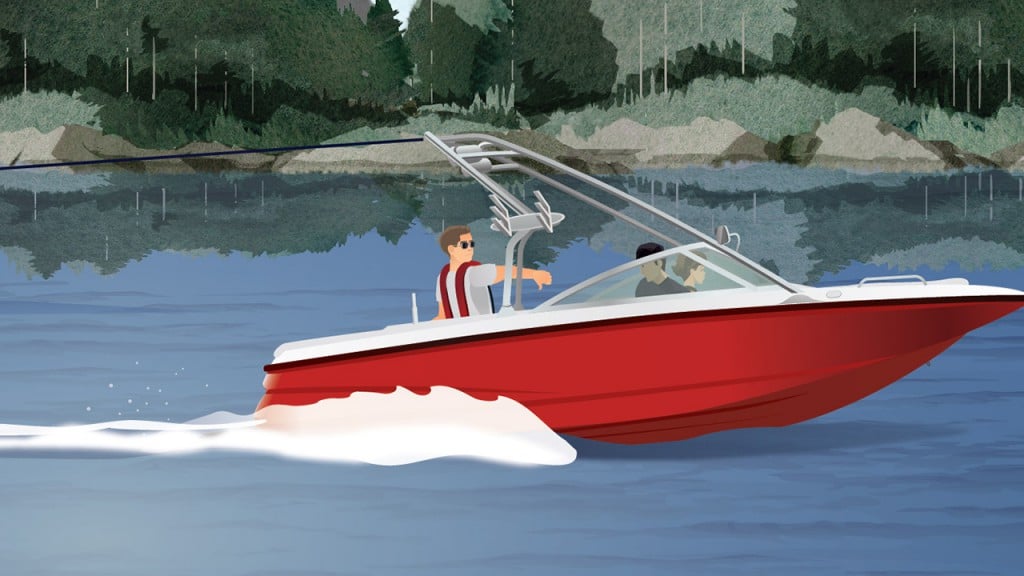 Boat towing a waterskier with a spotter on board