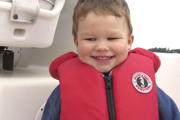 Child wearing a properly fitted life jacket.