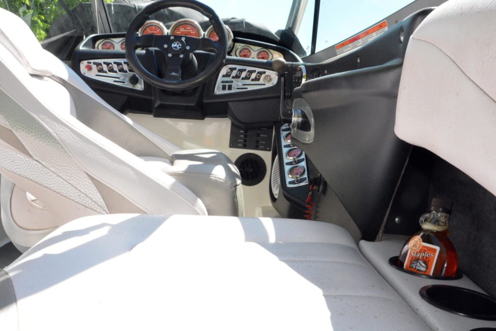 Syrup in a cup holder on a boat, Canadian boating concept. 