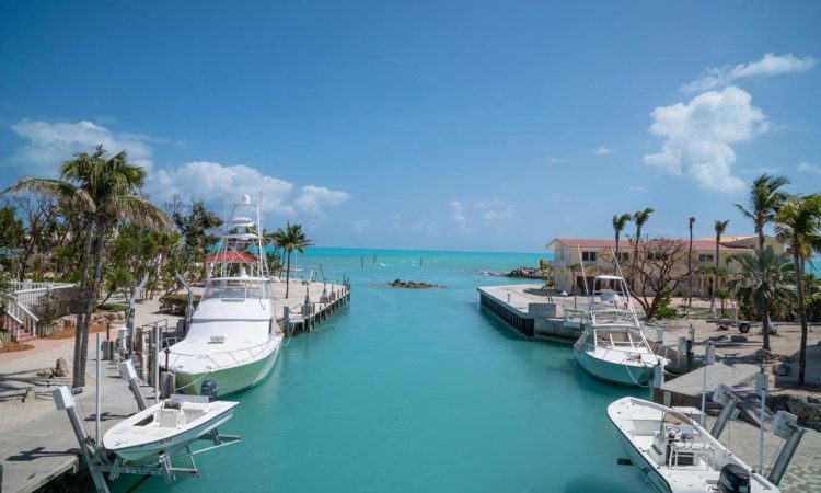 florida coast with moored boats along side of canal