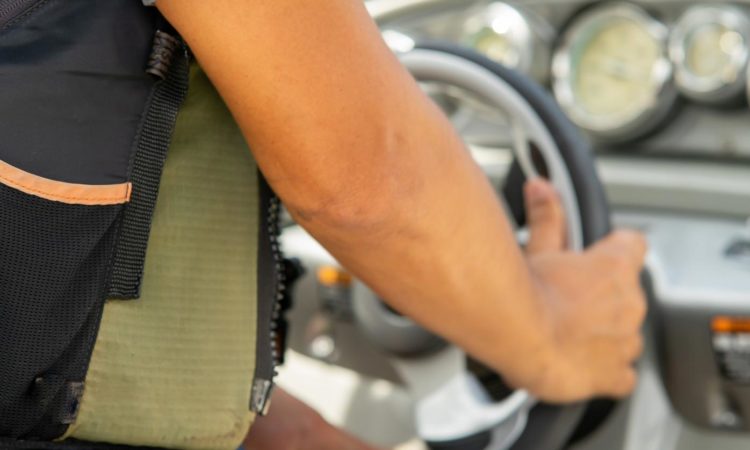 close up of boater driving boat