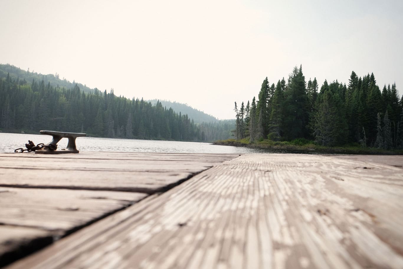 dock overlooking lake and mountains